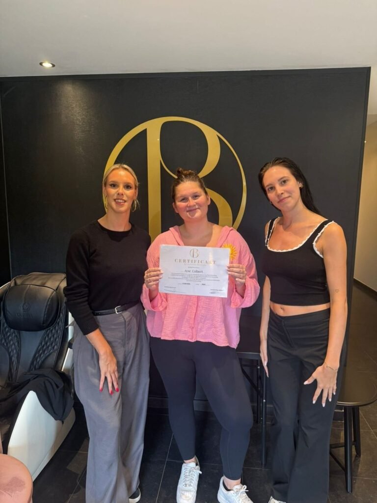 Practitioners receiving their head spa certificate at partner salon Belliza