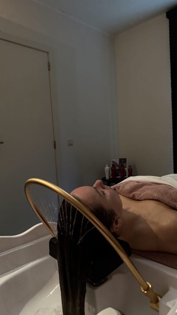 Client resting during a head spa treatment at partner salon Belliza
